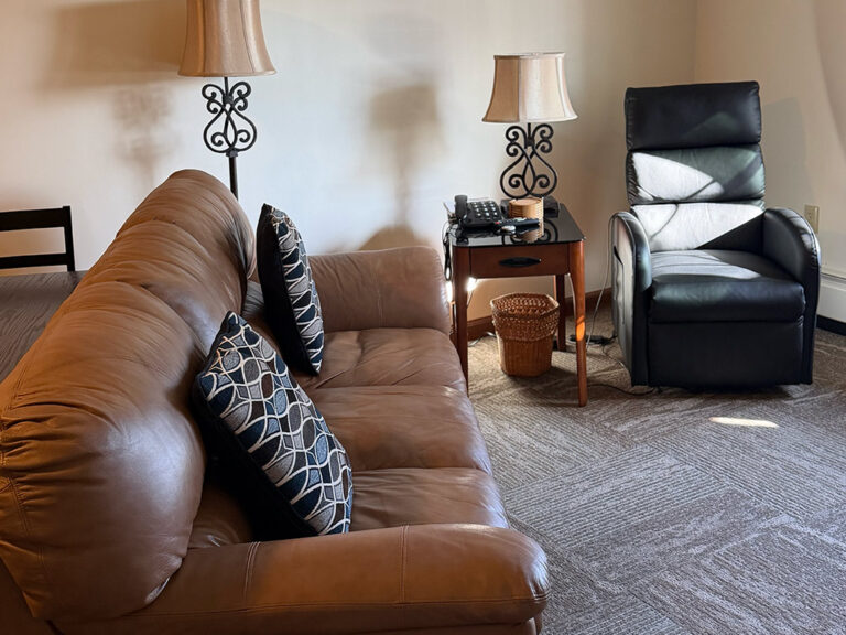 A couch and recliner in a living room.