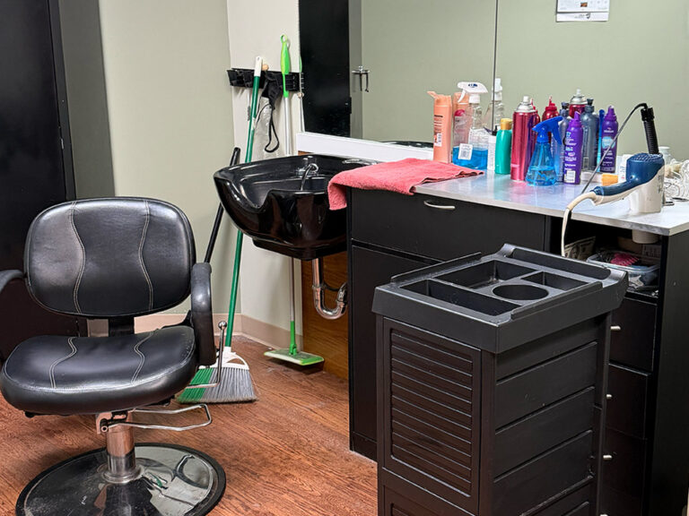 Salon chair and sink for haircutting.